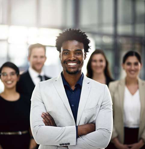 Cropped portrait of a group of businesspeople standing in the office.
